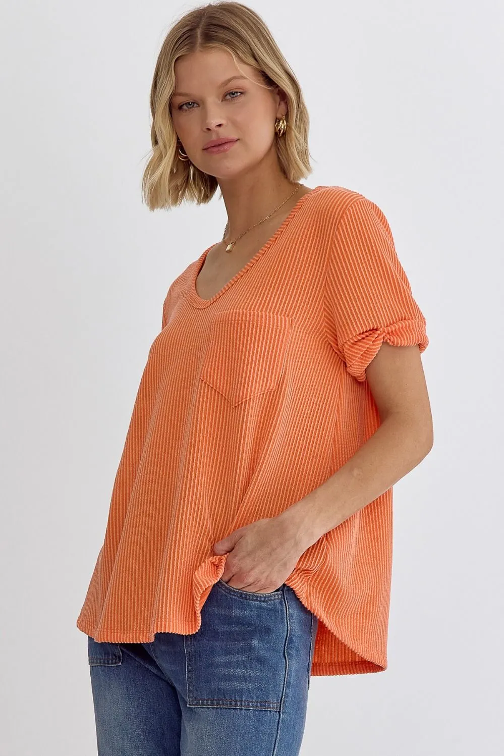 Erica V-neck short sleeve top featuring rolled sleeve hem and pocket at bust In Orange